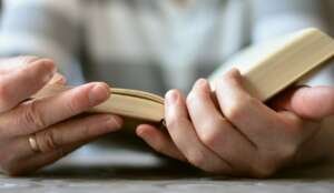 hands, a book, read
