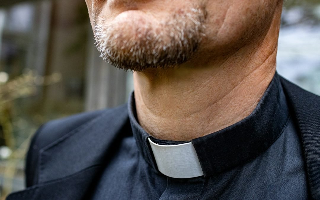 a close up of a man wearing a neck tie