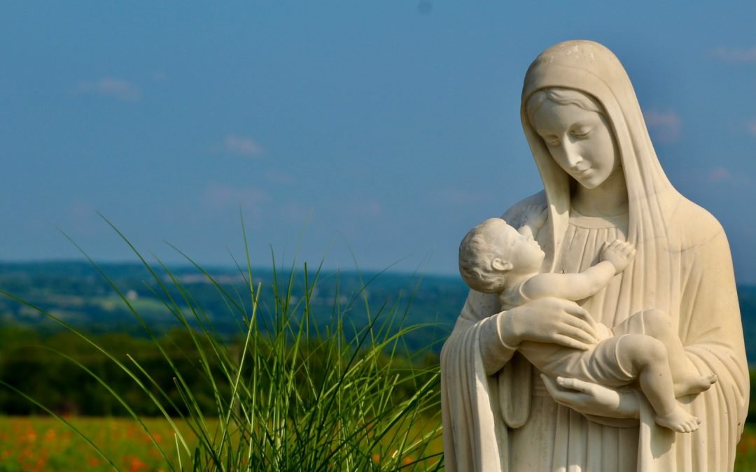 a statue of a person and a baby